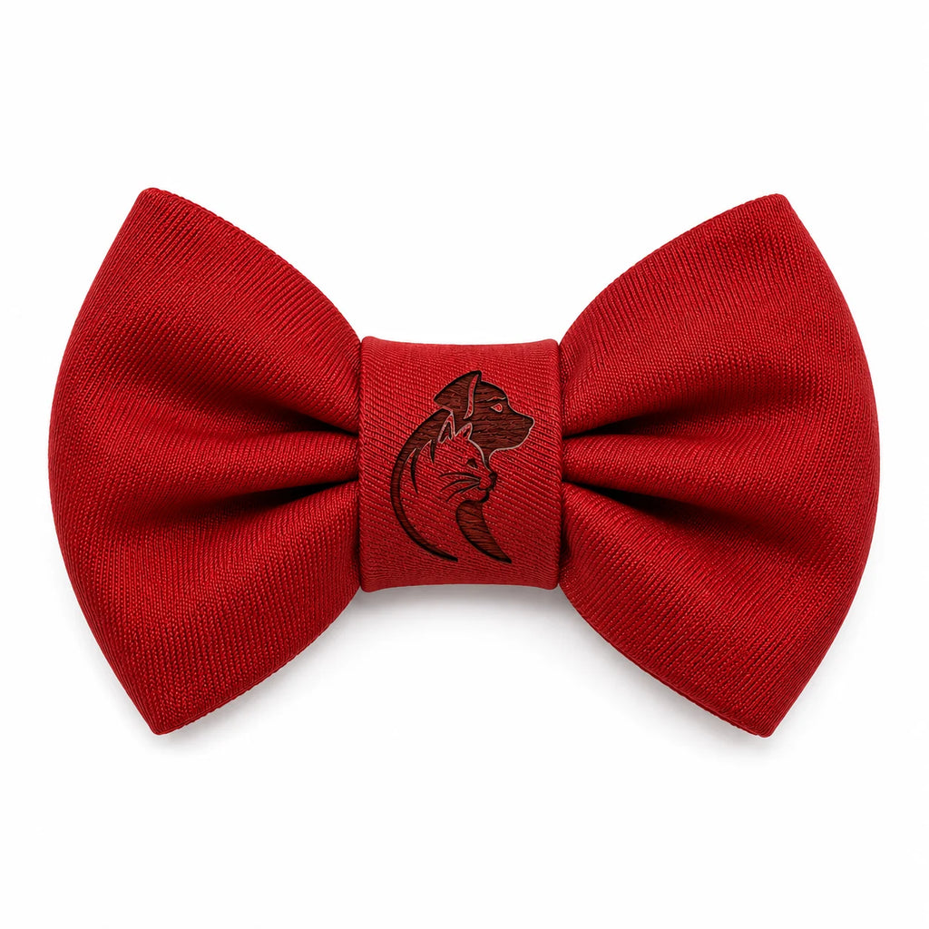 A vibrant red bow tie with a detailed dog head logo in the center