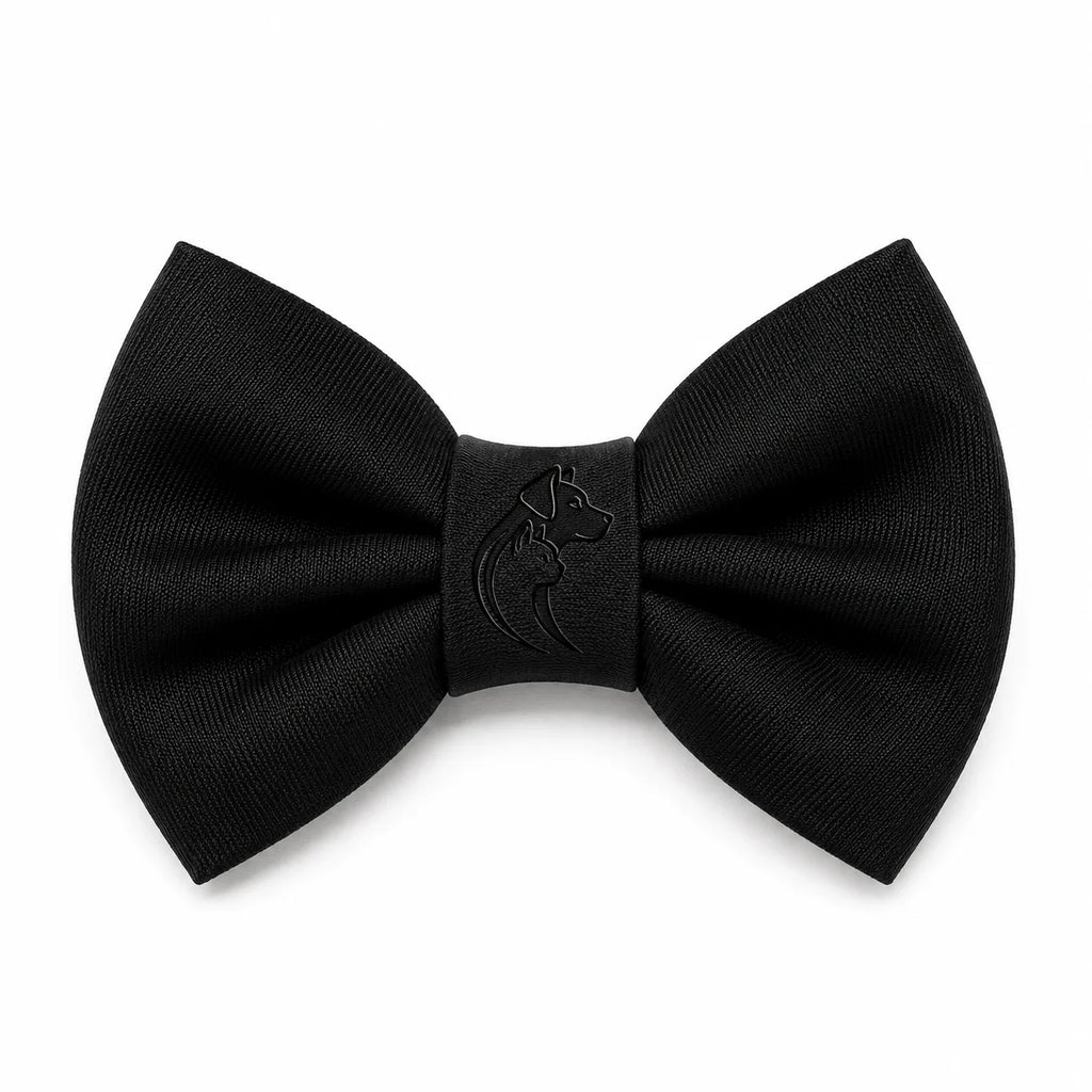 A black bow tie with a debossed dog logo on a white background, made of smooth fabric