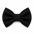 A black bow tie with a debossed dog logo on a white background, made of smooth fabric