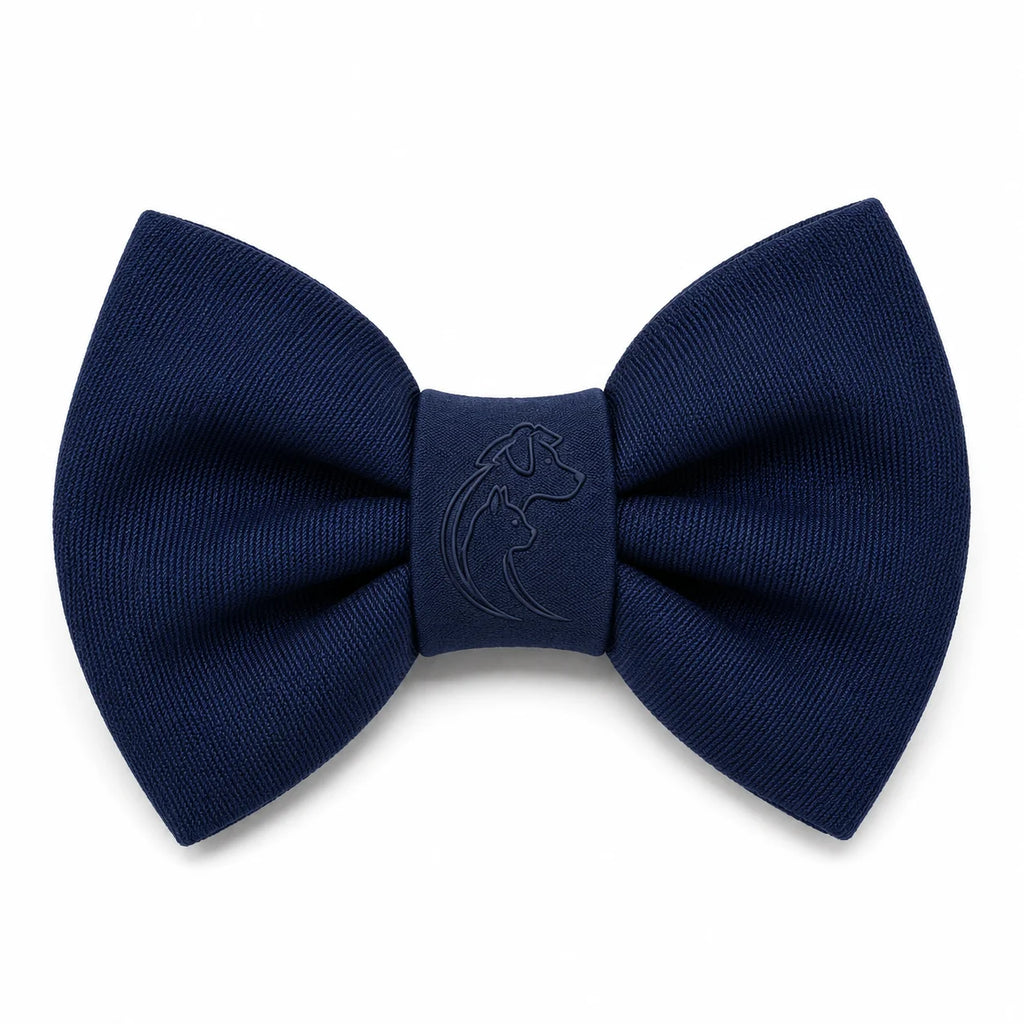 A navy blue bow tie with a debossed dog logo on a white background