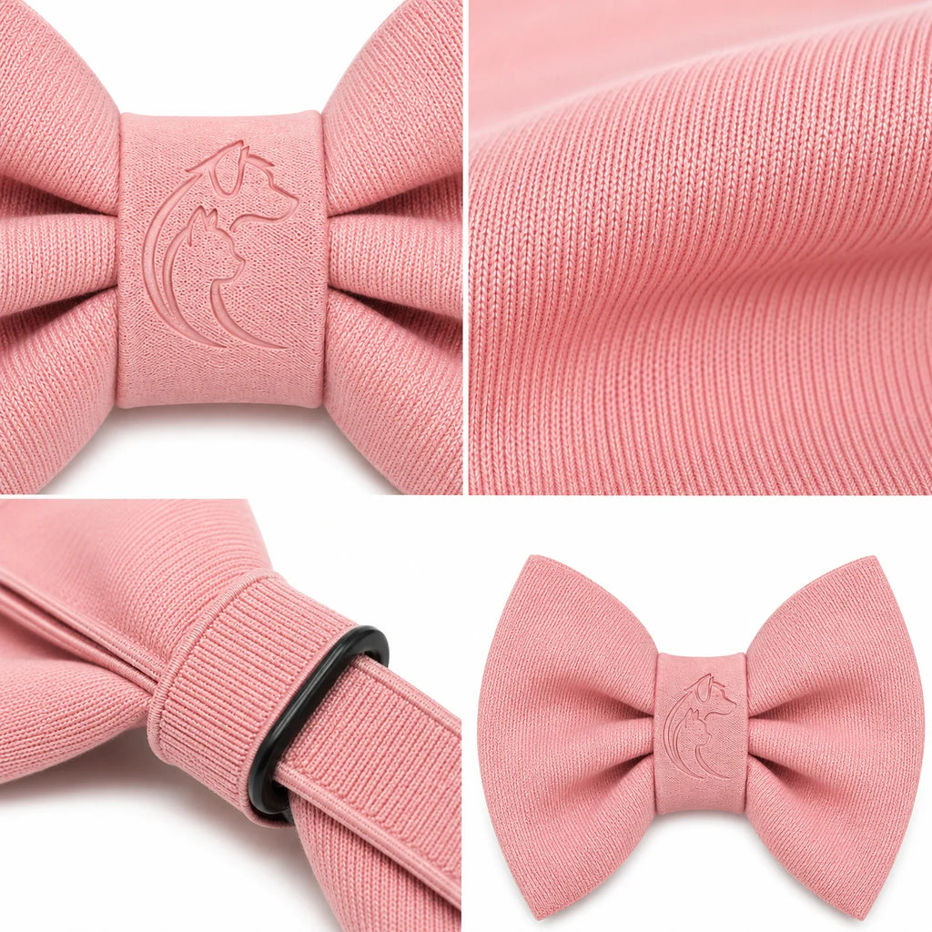 Pink bow tie with embossed dog and moon logo on textured fabric close-up
