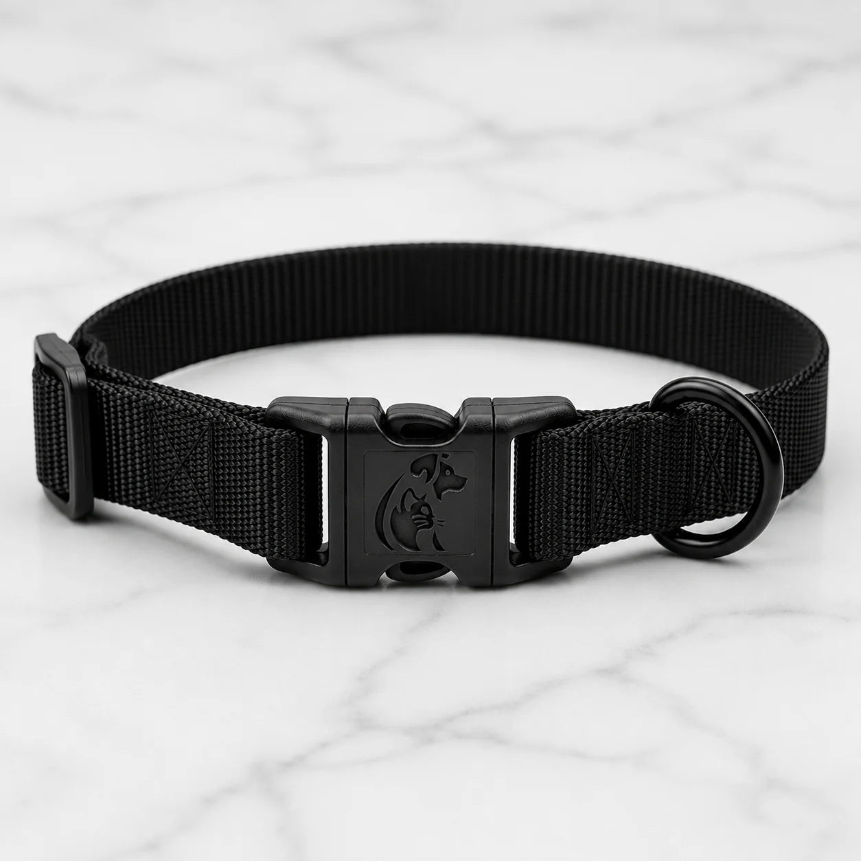 Black dog collar with buckle and ring on white marble surface close-up